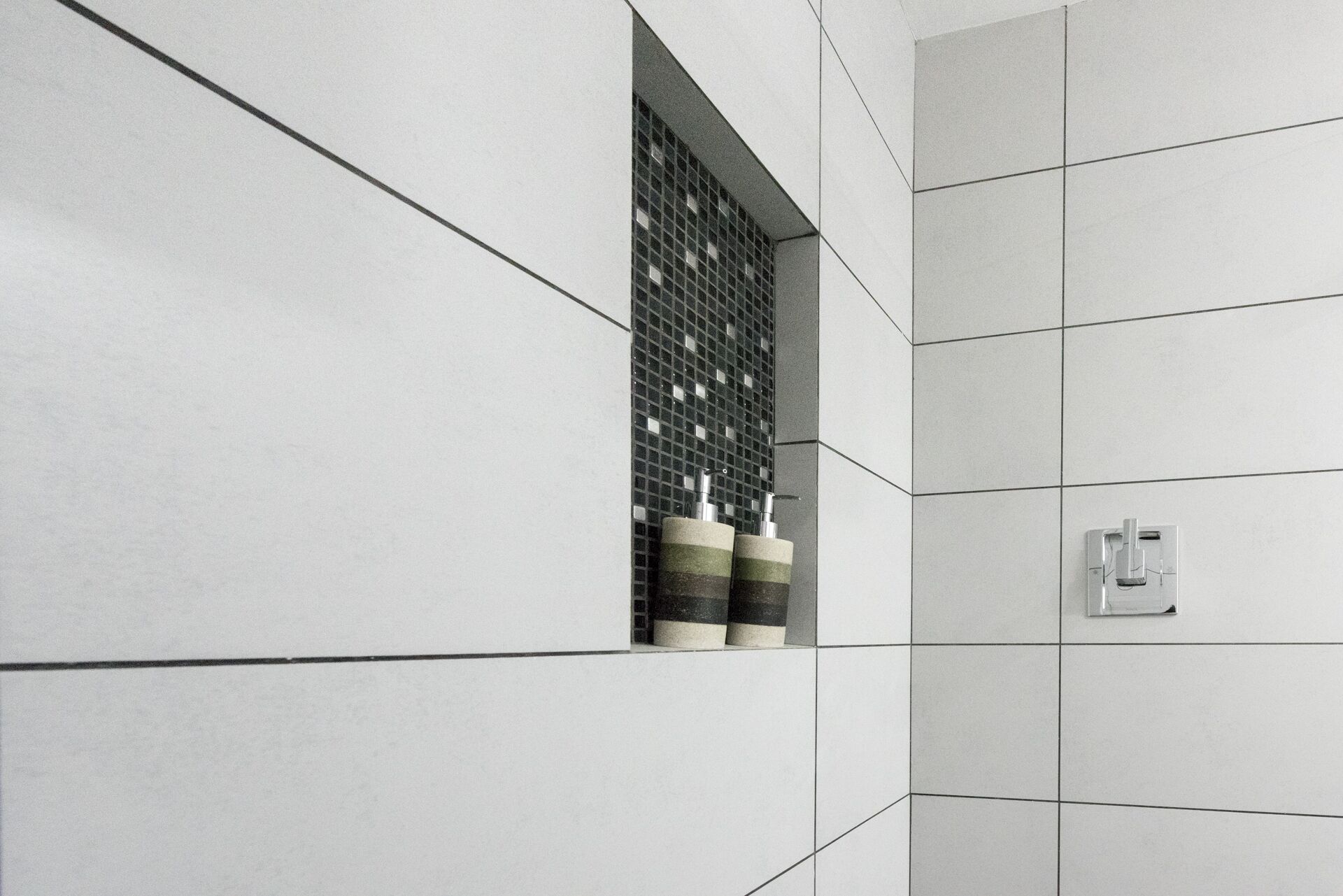 deluxe room | bathroom | shower, rainfall showerhead, free toiletries, hair dryer