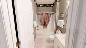 Bathtub, hair dryer, towels