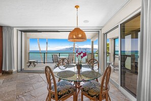 Enjoy meals at the dining table while taking in beautiful ocean views just beyond the lanai. - Beautiful updated 2bd condo, a sleek new finish (Lahaina)