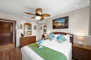 Comfortable second bedroom with warm tropical touches and convenient storage. - Beautiful updated 2bd condo, a sleek new finish (Lahaina)