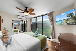 Rest comfortably in the bedroom with split air conditioning and a ceiling fan. - Beautiful updated 2bd condo, a sleek new finish (Lahaina)