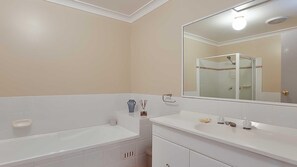 Bathtub, hair dryer - Sunset on Birubi, 2/40 Ocean Ave - pet friendly, air con, water views, WIFI and outdoor spa (Anna Bay)