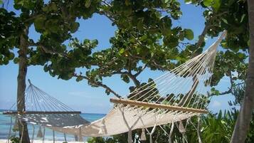 On the beach, sun loungers, beach towels