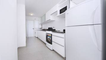 Apartemen, Beberapa Tempat Tidur, Bebas Asap Rokok, pemandangan taman | Dapur pribadi | Lemari es, microwave, dan mesin pembuat kopi/teh