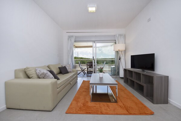 Apartment, Multiple Beds, Non Smoking, Park View | Living room | 32-inch LED TV with cable channels, TV - Milénica Flat IAC (Malagueño)