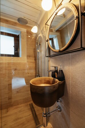 A modern bathroom with a wooden vanity, a round mirror, and a glass shower enclosure. - Stone villa with pool & fantastic sea views (with special autumn offers) (Rethymnon)