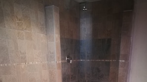 A bathroom with a shower, toilet, and sink. - Naisar Sparkling White Apartment (Germiston)
