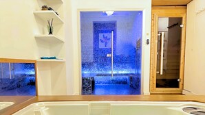 A bathroom with a bathtub, a shower area with mosaic tiles, and a wooden door. - Sparissimo, 6 Br / 4 Ba, 14 ppl, 220 m² (Paris)