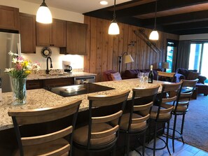 Enjoy cooking in the well-equipped kitchen with a central island and stovetop.