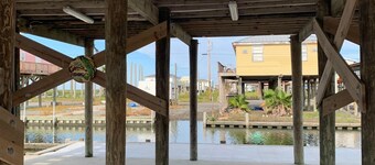 Experience waterfront living at Wahoo in Grand Isle, LA, with boat access and cozy amenities.