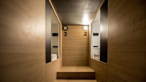 A narrow, wooden-floored corridor with numbers indicating room levels 2 and 3. - The CAPSULE by UnionSPACE - Adults Only (Bangkok)