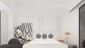 A modern bedroom with a large bed, a side table, a floor lamp, and a large abstract painting on the wall. - Zhongjian Rui Beiting hotel apartment (Shanghai)