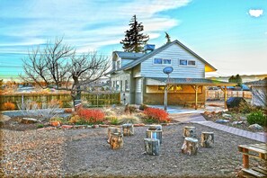 Enjoy a peaceful retreat in this two-story house with a well-maintained garden and a garage entrance.