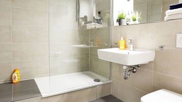 Apartment, 2 Bedrooms | Bathroom | Shower, free toiletries, hair dryer, towels