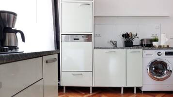 Apartment, 3 Bedrooms | Private kitchen | Full-sized fridge, microwave, oven, stovetop