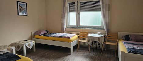 Triple Room, Shared Bathroom | Desk, free WiFi, bed sheets
