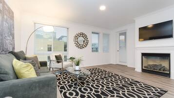 Exclusive Apartment, Multiple Beds, Non Smoking | Living room | TV