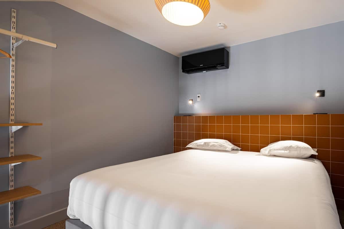 Premium bedding, memory foam beds, laptop workspace, soundproofing