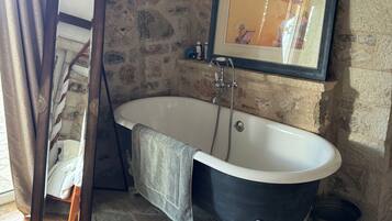 Bathtub, hair dryer, towels, soap