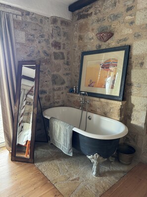 Bathtub, hair dryer, towels, soap