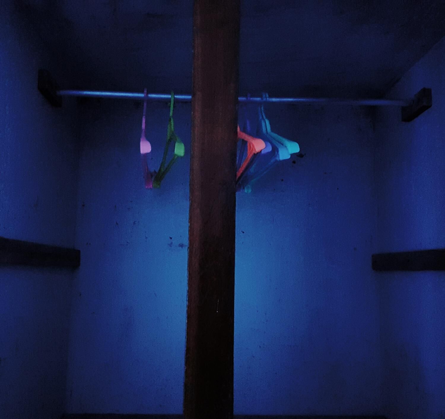 A room with a wooden beam and a blue wall.