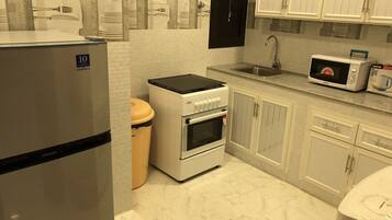 Apartment, 2 Bedrooms | Private kitchen | Fridge, microwave, stovetop, coffee/tea maker