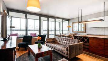 Panoramic Penthouse | Living room | 43-inch flat-screen TV with cable channels, TV, Netflix