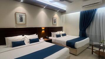 Premium Double Room, 2 Queen Beds, Partial Sea View | Premium bedding, desk, laptop workspace, blackout drapes
