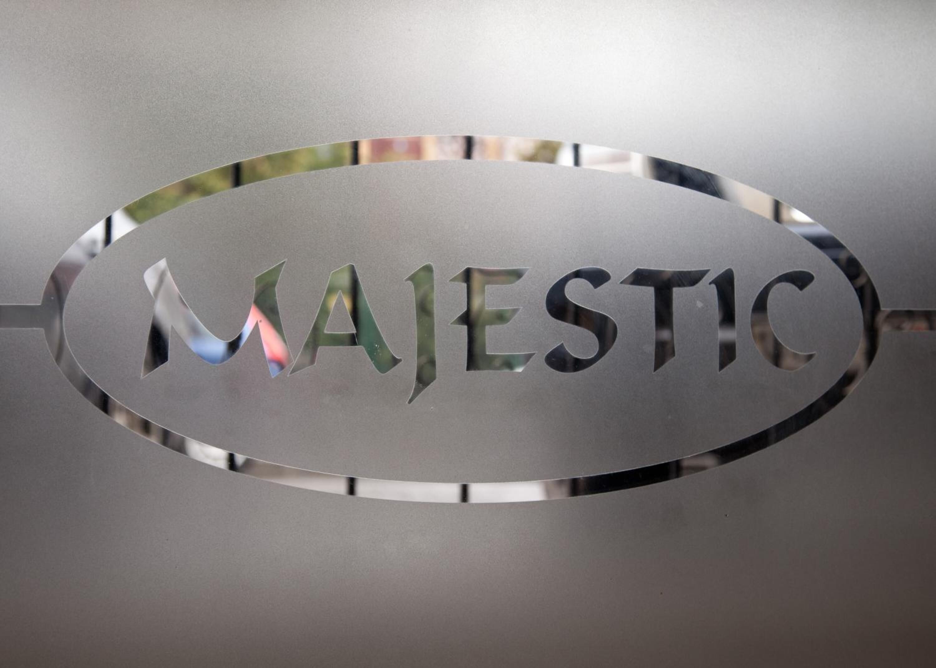 A metallic sign with the word "MAJESTIC" engraved on it.