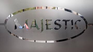 A metallic sign with the word "MAJESTIC" engraved on it.