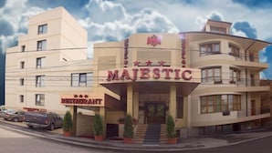 A building with a sign reading "MAJESTIC" and "RESTAURANT" indicating a hotel and dining establishment. - Hotel Majestic (Iasi)