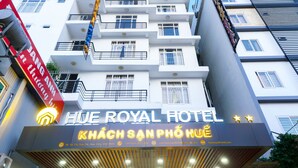 The exterior of Hue Royal Hotel with a prominent sign and a modern facade. - Hue Royal Hotel (Hue)