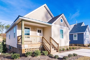 Stroll up to the inviting front porch with a set of stairs leading to the entrance.