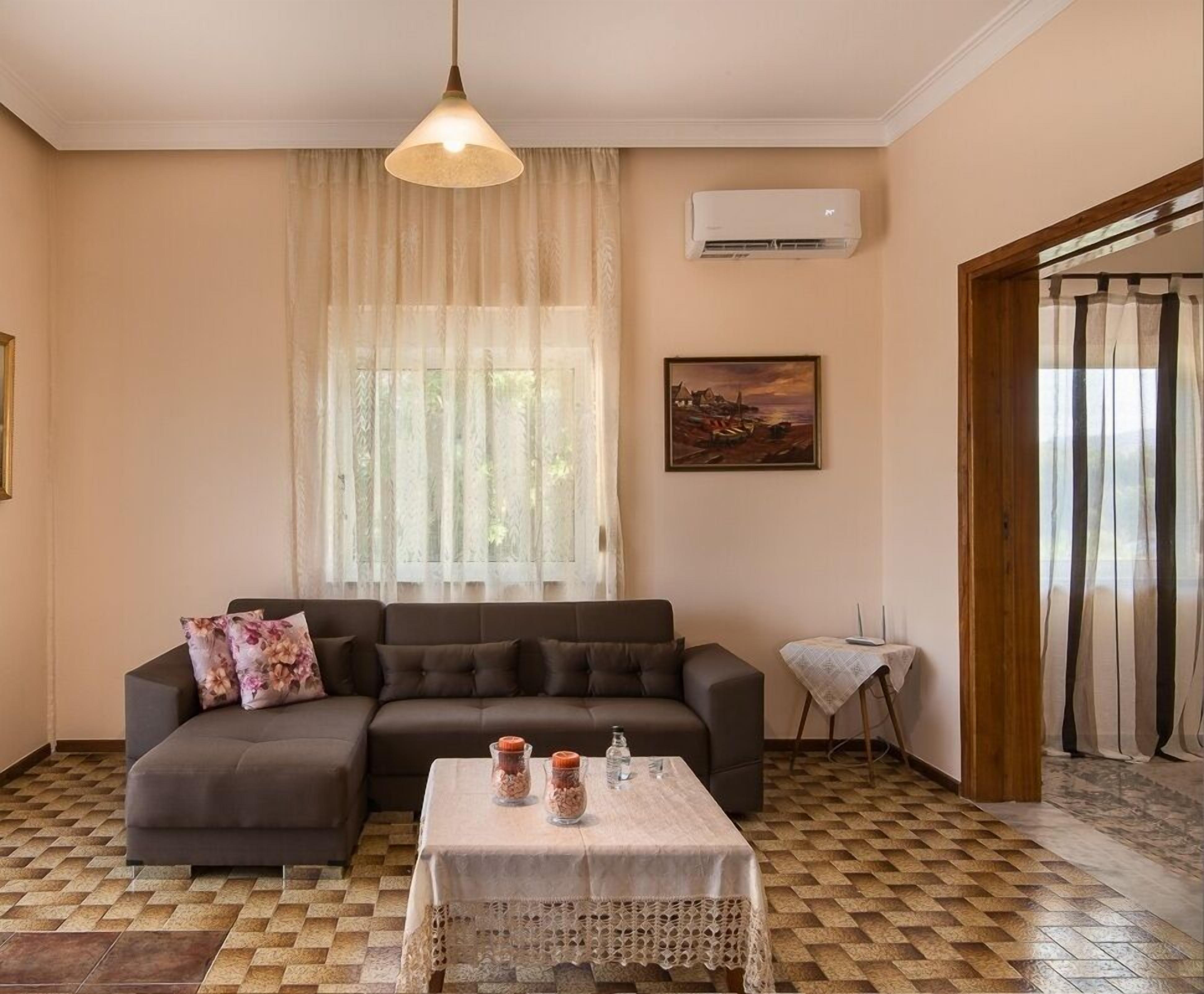 Family House, 2 Bedrooms | Living area | 22-inch flat-screen TV with digital channels, TV