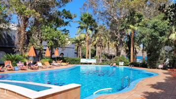 Seasonal outdoor pool, open 9:00 AM to 7:00 PM, pool umbrellas