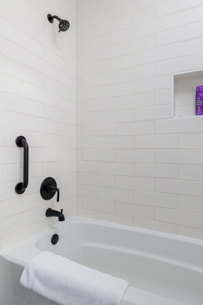 Combined shower/bathtub, hair dryer, towels, soap