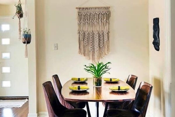 Macrame defines the dining space, with swivel chairs and large dining table that make everyone feel like hanging out.