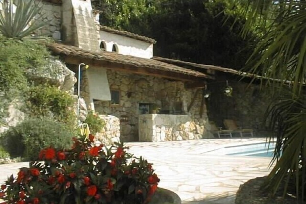 The stone pool house and BBQ