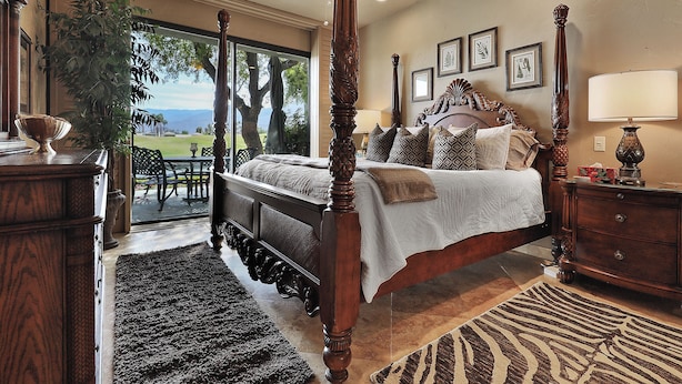 A bedroom with a four-poster bed, a large window, and a view of the outdoors. - Luxury Lake Front PGA West Golf Course View Townhome / Private Spa / Adults Only (La Quinta)