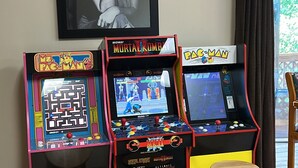 A room with arcade games, wooden stools, and a framed picture on the wall. - A piece of Heaven on Earth with all the comforts of home! (Gatlinburg)