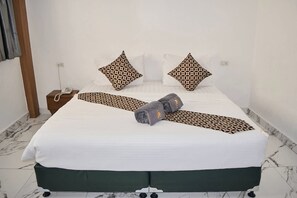 Quarto standard | Cofres nos quartos, Wi-Fi de cortesia, roupa de cama