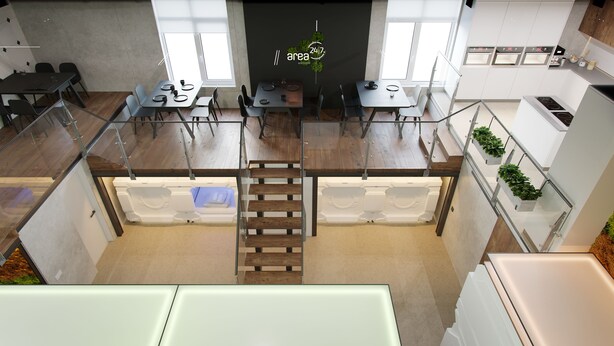 Una cocina moderna con dos zonas de comedor, una escalera central y vistas al cielo.