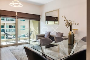 DHH - Secluded Yet Modern 1 Bed Al Alka The Greens | Living area | 42-inch LCD TV with cable channels, TV