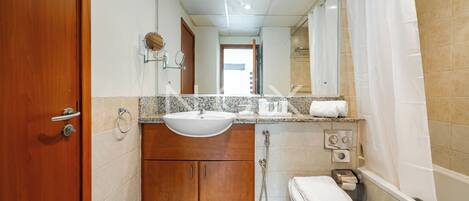 DHH - Secluded Yet Modern 1 Bed Al Alka The Greens | Bathroom | Combined shower/bathtub, free toiletries, hair dryer, towels
