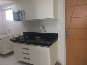 Fridge, microwave, stovetop, cookware/dishes/utensils