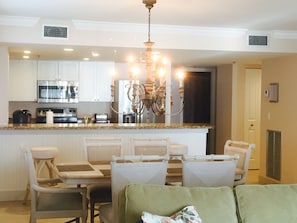 Enjoy meals in this well-equipped kitchen with a microwave, oven, and island with a granite countertop.