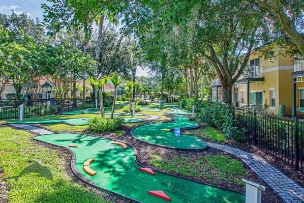 Play a round of golf amidst lush green surroundings and challenging obstacles.