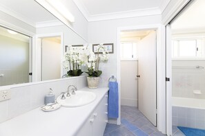 Bathtub, hair dryer, towels, soap