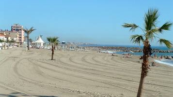 On the beach, sun loungers
