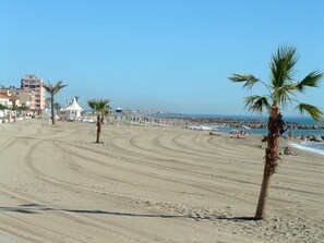 On the beach, sun-loungers